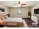 Serene bedroom with hardwood floors, a ceiling fan, a cozy area rug and a bright window, perfect for restful nights at 1420 Hickory Nut Ln, Lincolnton, NC 28092