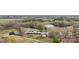Expansive aerial view showcasing the property's vast land, pond, and multiple outbuildings at 1620 London Rd, Mooresville, NC 28115