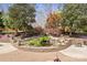 Backyard koi pond with waterfall, surrounding foliage and brick pavers at 1620 London Rd, Mooresville, NC 28115