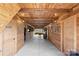 Spacious barn interior with wooden walls, restroom and kitchen doors, and natural lighting at 1620 London Rd, Mooresville, NC 28115