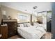 Stylish bedroom with a large bed, mirrored wall, modern lighting, and wood floors at 1620 London Rd, Mooresville, NC 28115