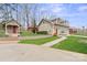 Home exterior, featuring a well-manicured lawn and guest house at 1620 London Rd, Mooresville, NC 28115