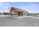 Charming office building with covered parking, stone accents, and a welcoming entrance at 1620 London Rd, Mooresville, NC 28115