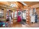 Inviting foyer with a red door, wood accents, and access to the dining room at 1620 London Rd, Mooresville, NC 28115