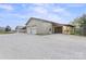 Large garages with ample parking space and a gravel driveway at 1620 London Rd, Mooresville, NC 28115