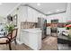 Modern kitchen with white cabinetry, stainless steel appliances, and tiled backsplash at 1620 London Rd, Mooresville, NC 28115