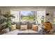 Living room view showcasing large windows and serene backyard landscape at 1620 London Rd, Mooresville, NC 28115