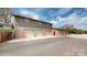 Large outbuilding featuring multiple garage doors and a red access door, offering ample space at 1620 London Rd, Mooresville, NC 28115