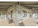 Inviting porch with a swing and decorative touches showcases the home's unique log cabin design at 1620 London Rd, Mooresville, NC 28115