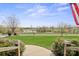 Scenic view from the porch featuring a grassy lawn and a serene pond in the distance at 1620 London Rd, Mooresville, NC 28115