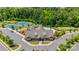 Aerial view of clubhouse featuring a pool, tennis courts, bocce ball, and ample parking at 17436 Langston Dr, Charlotte, NC 28278