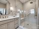Modern bathroom featuring a frameless glass shower with tiled walls, a seat, and vanity at 17436 Langston Dr, Charlotte, NC 28278