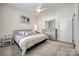 Bright bedroom featuring neutral walls, ceiling fan, and a comfortable bed with stylish bedding at 17436 Langston Dr, Charlotte, NC 28278
