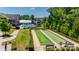 Exterior view of community bocce ball courts with a pool and clubhouse in the background at 17436 Langston Dr, Charlotte, NC 28278