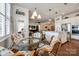 Bright breakfast nook with a glass table, wicker chairs, and seamless connection to the kitchen and living areas at 17436 Langston Dr, Charlotte, NC 28278