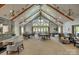 Spacious clubhouse interior featuring high ceilings with exposed beams and ample seating at 17436 Langston Dr, Charlotte, NC 28278