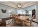 Dining room with hardwood floors opening into the living room and modern decor at 17436 Langston Dr, Charlotte, NC 28278