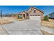 Charming stone-accented home with a wide driveway and attached two-car garage in a desirable neighborhood at 17436 Langston Dr, Charlotte, NC 28278
