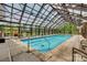 Bright indoor pool with a clear skylight and comfortable lounging chairs at 17436 Langston Dr, Charlotte, NC 28278