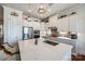 Modern kitchen with a central island, stainless steel appliances, pendant lighting, and ample counter space for cooking and entertaining at 17436 Langston Dr, Charlotte, NC 28278