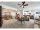 Open-concept living space seamlessly connects the living room, dining area, and kitchen with modern decor and ample natural light at 17436 Langston Dr, Charlotte, NC 28278