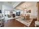 Open-concept living room and dining area with hardwood floors and comfortable seating at 17436 Langston Dr, Charlotte, NC 28278