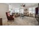 Spacious living room with large windows, comfortable seating, and an open floor plan at 17436 Langston Dr, Charlotte, NC 28278