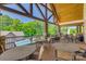 Outdoor patio with comfortable seating arrangements and views of the pool and surrounding greenery at 17436 Langston Dr, Charlotte, NC 28278