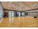 Spacious exercise room with hardwood floors, mirrors, and fitness equipment at 17436 Langston Dr, Charlotte, NC 28278