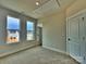 Bright, carpeted bedroom features two windows and a large closet with a white door at 2043 Clarksdale St # 31, Charlotte, NC 28206