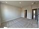 Neutral carpeted bedroom with an open doorway and a large walk in closet at 2043 Clarksdale St # 31, Charlotte, NC 28206