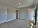 Neutral bedroom featuring carpeted floors, a ceiling light, and white trim at 2043 Clarksdale St # 31, Charlotte, NC 28206