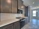 Kitchen features stainless appliances, gray cabinetry, white quartz countertops and subway tile backsplash at 2043 Clarksdale St # 31, Charlotte, NC 28206