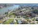 Scenic aerial view of the property with lake access and nearby tennis court at 2052 10Th Street Nw Pl, Hickory, NC 28601