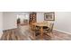 Finished basement with wicker table and chairs; warm brown flooring throughout at 2052 10Th Street Nw Pl, Hickory, NC 28601