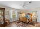 Charming bedroom with a wooden bed, hardwood floors, natural light from windows, and cozy decor at 2052 10Th Street Nw Pl, Hickory, NC 28601