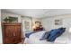 Bright bedroom with a large window, spacious closet, and a beautiful dark-wood dresser at 2052 10Th Street Nw Pl, Hickory, NC 28601