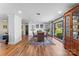 Bright dining area with hardwood flooring, china cabinet, fireplace and large windows at 2052 10Th Street Nw Pl, Hickory, NC 28601