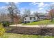 Beautifully landscaped home featuring an attached two-car garage and a well-manicured front yard at 2052 10Th Street Nw Pl, Hickory, NC 28601