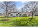 Charming single-story home featuring manicured lawn and mature trees at 2052 10Th Street Nw Pl, Hickory, NC 28601