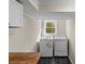 Laundry room area with new white washer and dryer and new flooring at 2052 10Th Street Nw Pl, Hickory, NC 28601