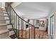 Finished basement living area with fireplace, stairs to main level, and access to more basement space at 2052 10Th Street Nw Pl, Hickory, NC 28601