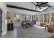 Bright sunroom with a large rug, tile flooring, and expansive windows offering natural light and scenic views at 2052 10Th Street Nw Pl, Hickory, NC 28601