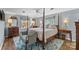 Cozy main bedroom featuring a four-poster bed, wooden floors, and natural light from the windows at 2052 10Th Street Nw Pl, Hickory, NC 28601