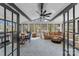 Bright sunroom with floor to ceiling windows, hardwood floors and lots of seating at 2052 10Th Street Nw Pl, Hickory, NC 28601