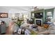 Open-concept living room with a fireplace, green accent wall, and seamless flow to the kitchen at 209 S Gardner Ave, Charlotte, NC 28208