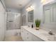 Bright bathroom with dual sinks, framed mirrors, and shower-tub combo, perfect for a refreshing start at 2249 Cigar Ct, Charlotte, NC 28273