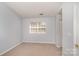 Neutral bedroom featuring carpet, window, and light blue walls at 2249 Cigar Ct, Charlotte, NC 28273