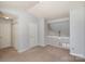 Bright living room with neutral carpet, white walls, staircase overlook and closet at 2249 Cigar Ct, Charlotte, NC 28273