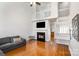 Bright living room with fireplace, vaulted ceiling, hardwood floors, and access to other rooms at 2249 Cigar Ct, Charlotte, NC 28273